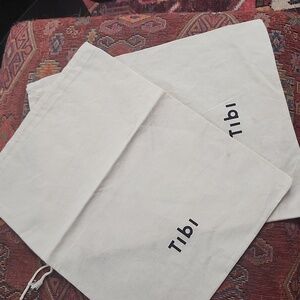Two Tibi dust bags